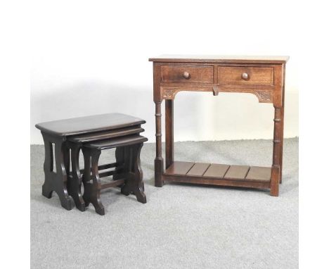 A nest of three Ercol occasional tables, together with a wall shelf and an oak side cabinet, 76cm (3)