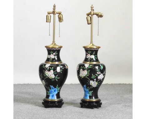 A pair of Japanese black cloisonne table lamp bases, each of baluster shape, decorated with flowers, on a wooden base, 75cm h