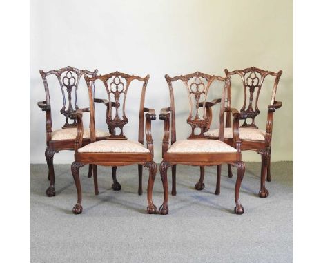 A set of four 20th century Chippendale style carved mahogany carver chairs, on cabriole legs