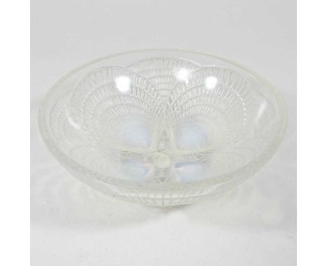 A Rene Lalique opalescent glass bowl, circa 1930's, decorated in the coquilles pattern, etched mark to base and numbered 3204