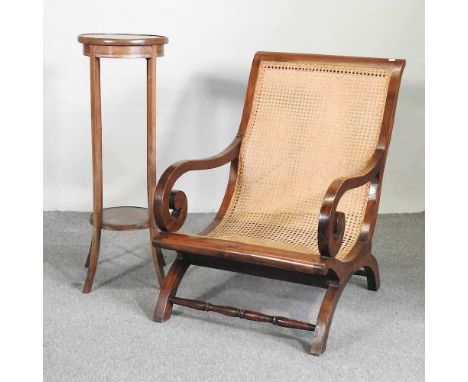 A cane seated arm chair, together with an Edwardian jardiniere stand, 96cm high (2)Overall the chair is solid and usable. The