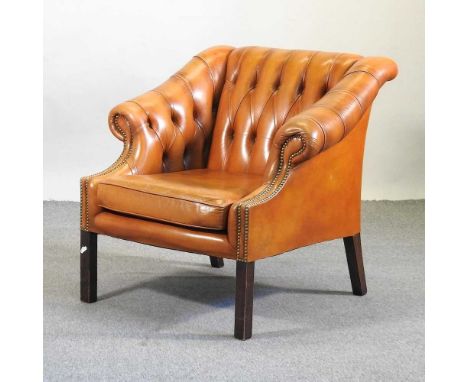 A brown leather upholstered button back arm chair, 20th century, with scrolled arms, on square legs89cm wideCondition report: