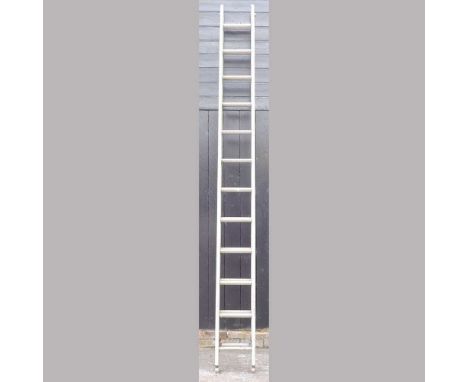 An aluminium ladder, in two sections, 610cm longCondition report: Each section is approximately 300cm long. Used, but looks c