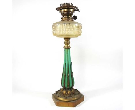 An unusual late 19th century patent brass and green glass oil lamp, of lobed shape, with a cut glass font, 54cm high