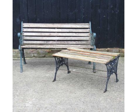 A slatted garden bench, with green painted metal ends, 126cm, together with a similar table (2)126w x 70d x 76h cm