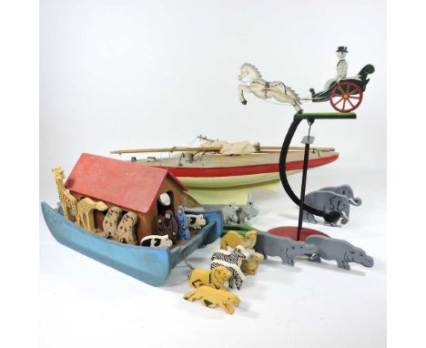 A vintage painted metal balance toy, in the form of a horse and carriage, 45cm high, together with a mid 20th century Tiger T