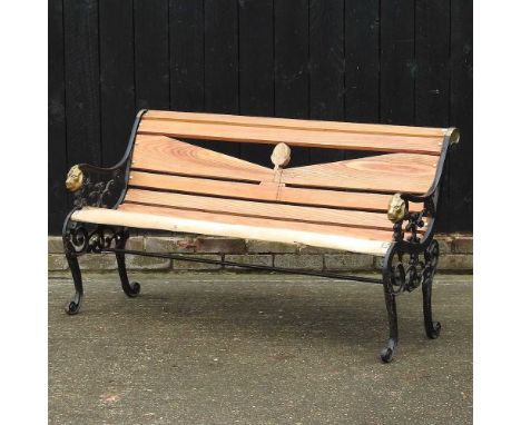 A cast iron wooden slatted garden bench, with lion mask arms149w x 47d x 78h cm