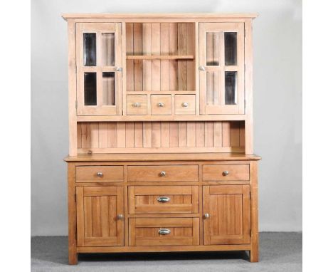 A modern light oak glazed dresser, with a limed oak upper section165w x 67d x 212h cm
