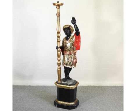 A large Venetian style polychrome painted wooden figural lamp, on an ebonised plinth base, 175cm high