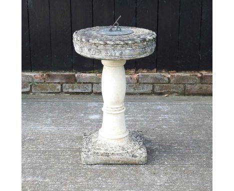 A reconstituted stone sundial, 74cm high