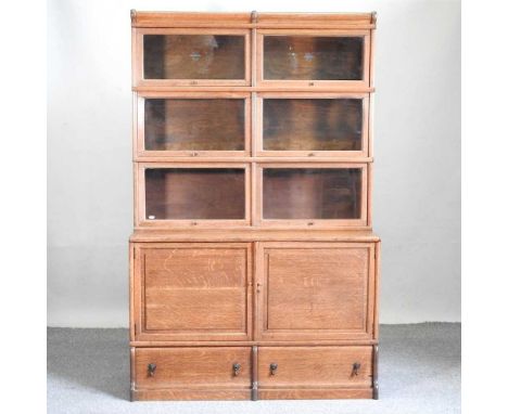 An early 20th century Globe Wernicke glazed sectional bookcase, with three tiers and cupboards below115w x 48d x 181h cmCondi