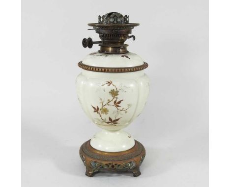 A 19th century Worcester blush ivory porcelain oil lamp, on a gilt metal base, 35cm high