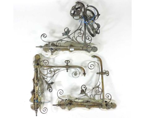 Three early 20th century brass gas light wall brackets, each 34cm high (3)
