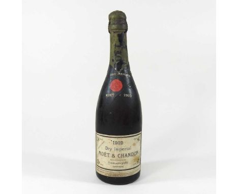 A vintage bottle of 1919 Dry Imperial Moet &amp; Chandon Champagne, 32cm highCondition report: The bottle is very dirty. Ther