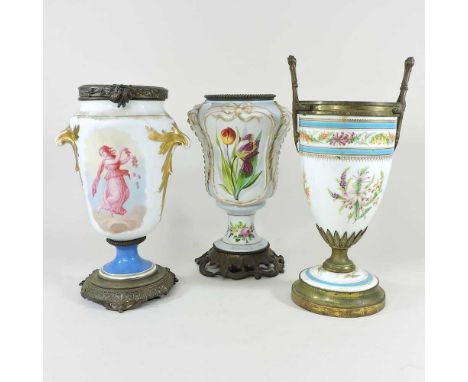 A collection of three 19th century French porcelain lamp bases, each reserved with coloured flowers, tallest 39cm (3)