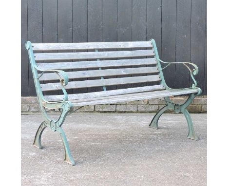 A wooden garden bench, with green painted ends, 130cm wide