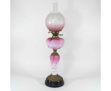 A 19th century pink opaline glass and brass oil lamp, with an etched pink glass shade, 67cm highCondition report: Shade is ve