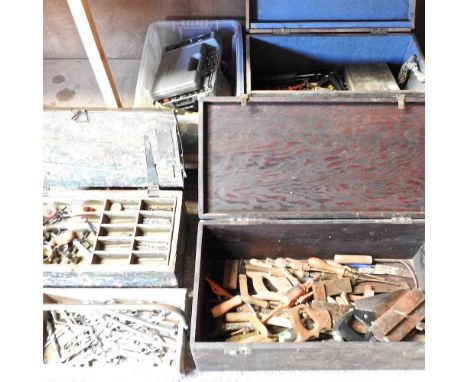 A collection of hand tools and wooden boxes, together with a work bench