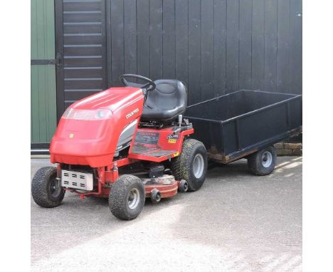A Countax C300 ride on petrol lawnmower, together with a black single axle trailer (2)Condition report: This has not been use