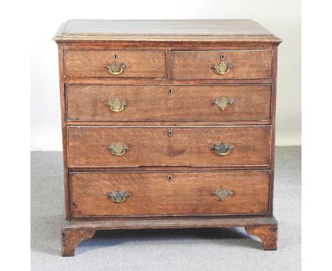 A George III oak chest, containing two short over three graduated long drawers, on bracket feet99w x 57d x 100h cm