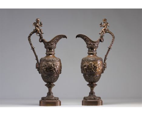 A pair of bronze ewers decorated with children figures in the style of Alphonse Giroux - Weight: 13.40 kg - Shipping unavaila