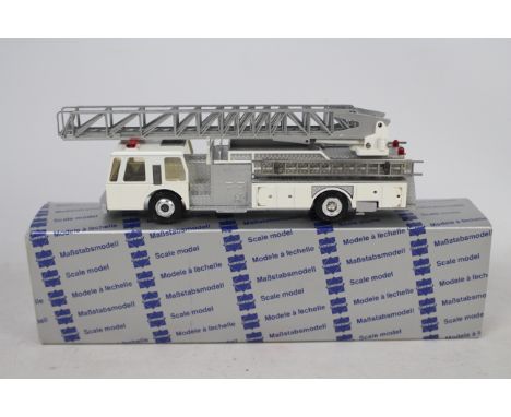 Conrad - A boxed 1:50 scale Conrad #5506 Emergency One Turntable Ladder Fire Engine. The model in white appears to be in Mint