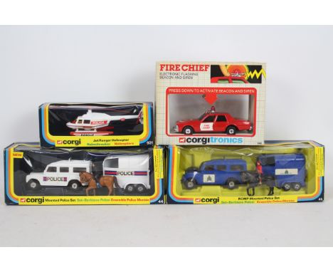 Corgi - Four boxed Corgi diecast model vehicles. Lot consists of Corgi #931 Jet Ranger Helicopter; #45 RCMP Mounted Police Se