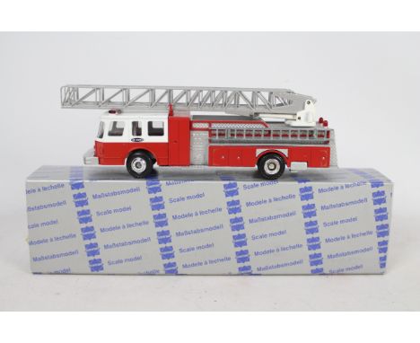 Conrad - A boxed 1:50 scale Conrad #5504 Emergency One Turntable Ladder Fire Engine. The model in red appears to be in Mint c