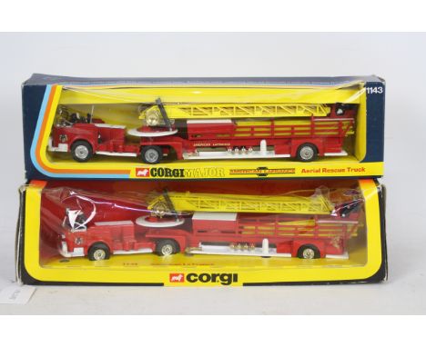 Corgi - A boxed pair of Corgi #1143 American LaFrance Aerial Ladder Rescue Trucks. Both models appear to be in Very Near Mint