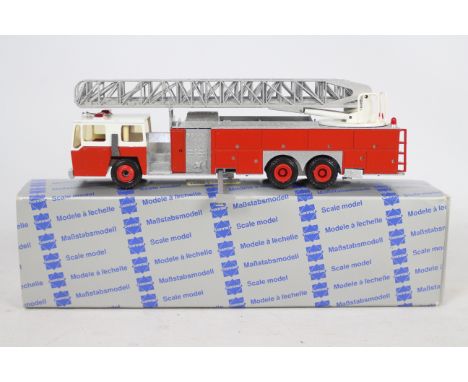 Conrad - A boxed 1:50 scale Conrad #5504 Emergency One Turntable Ladder Fire Engine. The model in red appears to be in Mint c