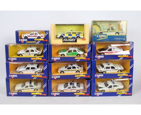 Corgi, Husky - A squad of 12 boxed diecast 'Police' cars predominately 1:43 scale by Corgi. Lot includes Corgi C438 Rover 800