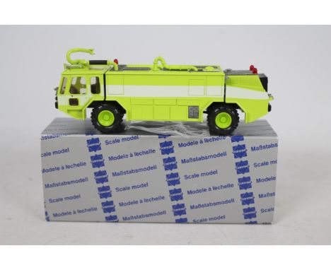 Conrad - A boxed 1:50 scale Conrad #5507 Emergency One Titan III Airport Crash Tender . The model in green appears to be in V