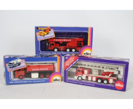 Siku - Three boxed 1:50 and 1:55 scale diecast European Fire Appliances from Siku. Lot consists of Siku #2524 ARAL Tanker; #3