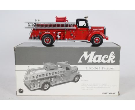 First Gear - A boxed First Gear 1:34 scale CFD19-3169 Mack L Model Pumper. The model 'Engine 50' in Chicago Fire Department l