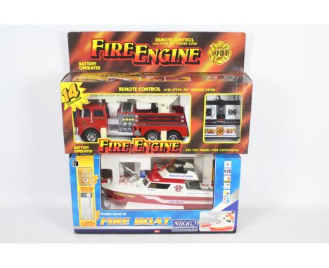 Nikko, Other - Two boxed plastic radio controlled Fire Appliances. Lot consists of a Nikko Fire Boat, and an unbranded Fire E