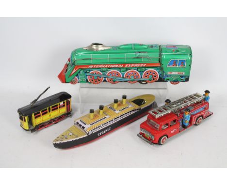 Rattandeep - MF - 4 x clockwork / friction powered tinplate toys including a Fire Engine, Steam loco, Titanic and a tram car.