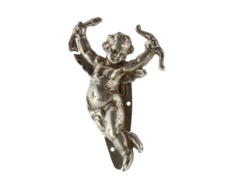 An antique cherub brooch / dress clip in silver by Keim Ltd of London circa 1930 designed to depict a cherub in high relief h