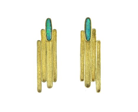 An pair of vintage opal clip earrings in 18ct yellow gold with French assay marks, each designed four variously sized concave