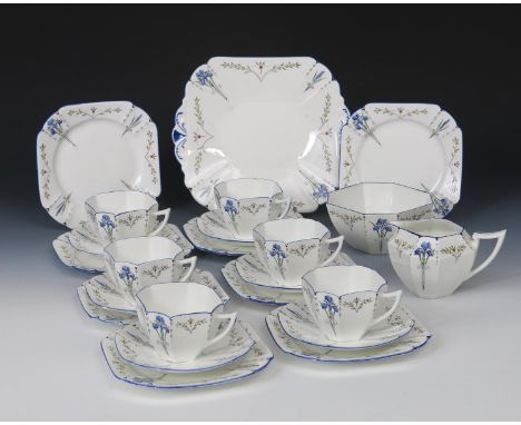 A Shelley Pottery Blue Iris Queen Anne tea set for twelve designed by Eric Slater, pattern no.11561, printed and enamelled in