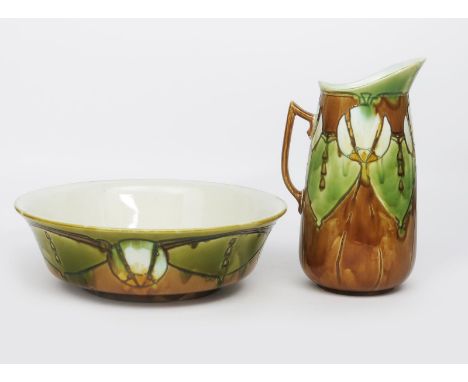 A Minton's Secessionist wash basin and ewer designed by Leon Solon and John Wadsworth, model no.14,  tubeline decorated with 