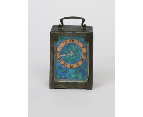 A Liberty & Co English Pewter and enamel carriage clock designed by Archibald Knox, model no.0721, the rectangular case cast 