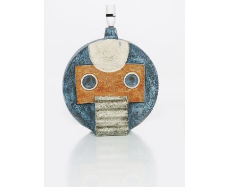 A Troika Pottery large Wheel lamp by Simone Kilburn, circular cast in relief with a geometric face motif in ochre, white and 