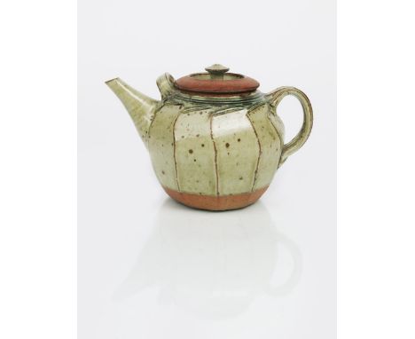 Richard Batterham (born 1936) a large cut-sided stoneware teapot and cover, covered in an ash glaze with an iron speckle, the