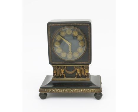 A continental polished slate and gilt metal mantel clock probably Austrian,  in the manner of Otto Prutscher, tapering base o