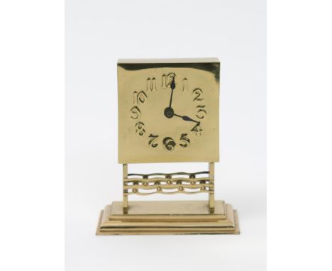 A continental Art Nouveau polished brass mantle clock, square section face with raised Arabic numerals, above pierced decorat