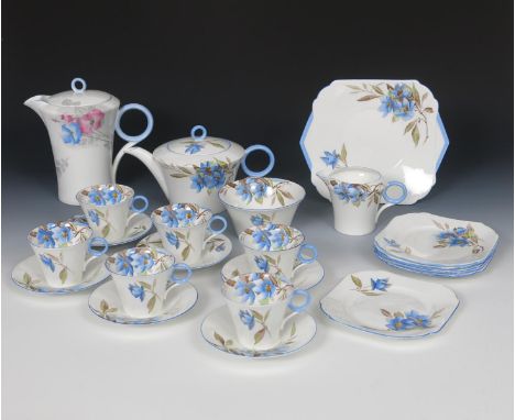 A Shelley Regent Syringa tea service designed by Eric Slater, pattern no.12025, printed and painted with flowers and foliage,