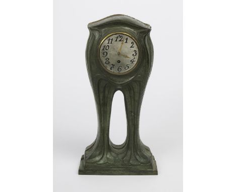 An Art Nouveau verdi gris patinated metal mantel clock,  with circular dial and Arabic numerals, unsigned, 45cm. high