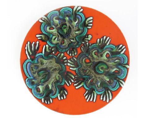 A Poole Pottery Delphis charger by Jean Millership, shape no.5, painted with three abstract roundels in blue black and turquo