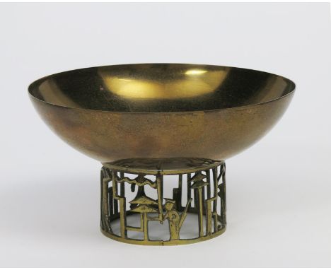 A Hagenauer Golfer pedestal bowl, gilded brass bowl on pierced metal base with golfers playing amongst stylised pine trees un