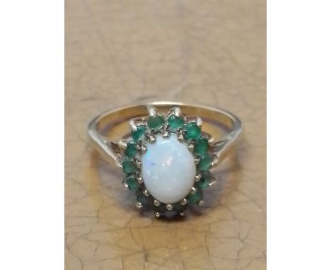 A hallmarked 9ct gold opal and emerald cluster ring, gross wt. 2.4g, size N. 